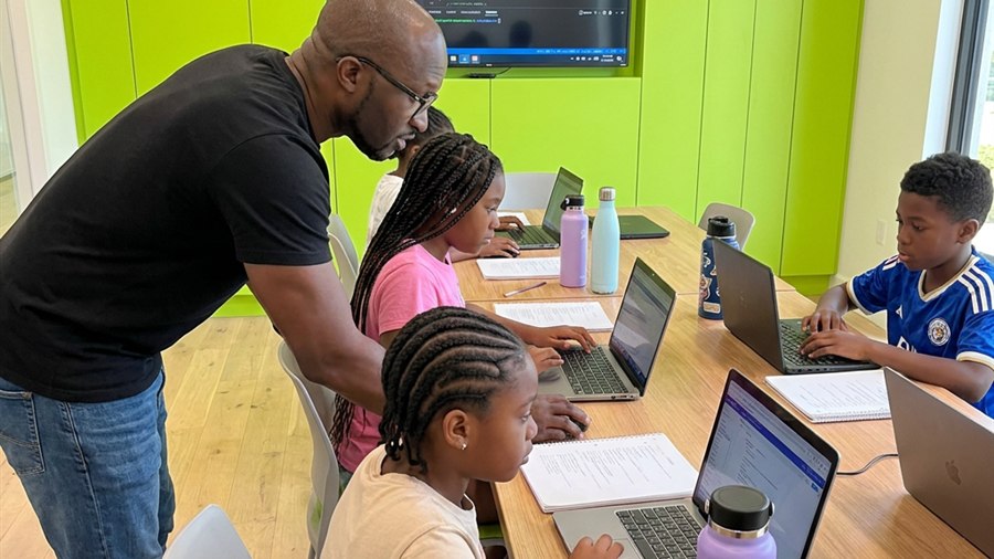 Students working on laptops during Creator Course